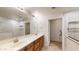 Spacious bathroom featuring double sinks, tile flooring, and accessible shower at 21320 N 56Th St # 1158, Phoenix, AZ 85054