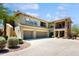 Multi-story building exterior showcasing garages, stone accents, and landscaping at 21320 N 56Th St # 1158, Phoenix, AZ 85054
