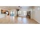 Open-concept living room features tile floors, sliding glass doors to a balcony, and a stone fireplace at 21320 N 56Th St # 1158, Phoenix, AZ 85054