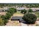 Spacious property boasting a well-maintained lawn, mature trees, and a cozy single-story home at 23265 S Via Del Arroyo --, Queen Creek, AZ 85142