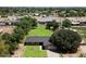 Expansive property featuring a well-maintained lawn, mature trees, and a charming single-story home at 23265 S Via Del Arroyo --, Queen Creek, AZ 85142