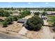 Aerial shot of property showcasing spacious yard, mature trees, and charming home at 23265 S Via Del Arroyo --, Queen Creek, AZ 85142