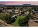 Expansive aerial view of the property featuring mature trees, horse facilities, and a serene desert landscape at 23265 S Via Del Arroyo --, Queen Creek, AZ 85142