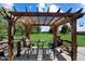 Outdoor patio under a pergola, perfect for al fresco dining and entertaining at 23265 S Via Del Arroyo --, Queen Creek, AZ 85142