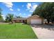 Charming ranch home with brick facade, mature trees, and a well-maintained lawn at 23265 S Via Del Arroyo --, Queen Creek, AZ 85142