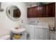 Functional laundry room with washer, dryer, sink and plenty of storage at 23265 S Via Del Arroyo --, Queen Creek, AZ 85142