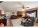 Cozy living room featuring a brick fireplace and comfortable seating at 23265 S Via Del Arroyo --, Queen Creek, AZ 85142