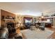 Spacious living area with fireplace, tile floors, and comfortable seating at 23265 S Via Del Arroyo --, Queen Creek, AZ 85142