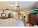 Spacious main bedroom with wood floors and ensuite bathroom at 23265 S Via Del Arroyo --, Queen Creek, AZ 85142