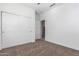 Bedroom with carpet, closet, and a door to hallway at 25601 N 140Th Ln, Surprise, AZ 85387