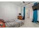 Bedroom with modern ceiling fan, wood flooring, and lots of room at 25601 N 140Th Ln, Surprise, AZ 85387