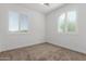 Bedroom with natural light from windows and carpeted floor at 25601 N 140Th Ln, Surprise, AZ 85387