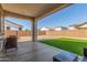 Covered patio with view of gravel, turf, and block fence at 25601 N 140Th Ln, Surprise, AZ 85387