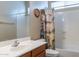 Bathroom with a single sink vanity, a large mirror, a toilet, and a shower tub with a curtain at 2567 E San Isido Trl, Casa Grande, AZ 85194