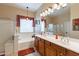 Spacious bathroom with double sinks, a soaking tub, and a separate shower, with warm tones at 2567 E San Isido Trl, Casa Grande, AZ 85194