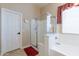 Bathroom showcasing a glass-enclosed shower, soaking tub, and neutral color palette at 2567 E San Isido Trl, Casa Grande, AZ 85194