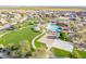 Community sports area featuring a volleyball court, picnic tables, playground, and green spaces at 2567 E San Isido Trl, Casa Grande, AZ 85194
