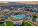 Scenic aerial view of community park, splash pad, playground, and picnic area at 2567 E San Isido Trl, Casa Grande, AZ 85194
