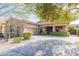 Inviting single-Gathering house showcasing a well-kept lawn, spacious driveway and desert landscaping at 2567 E San Isido Trl, Casa Grande, AZ 85194