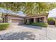 Beautiful single-Gathering home boasting a two-car garage and neatly trimmed front yard hedges at 2567 E San Isido Trl, Casa Grande, AZ 85194
