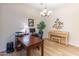 A home office features a desk, computer, piano, and hardwood floors, creating a workspace at 2567 E San Isido Trl, Casa Grande, AZ 85194