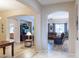 Open-concept living spaces showcase hardwood flooring and seamless flow between living room, dining area, and kitchen at 2567 E San Isido Trl, Casa Grande, AZ 85194