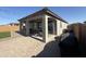 Inviting covered patio, complete with pavers, and outdoor furniture, perfect for relaxing and entertaining outdoors at 25968 W Tina Ln, Buckeye, AZ 85396