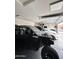 Spacious three-car garage featuring ample storage and parking for vehicles, recreational equipment, and tools at 25968 W Tina Ln, Buckeye, AZ 85396