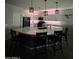 The kitchen features a large island with bar seating, pendant lighting, and sleek white cabinetry at 25968 W Tina Ln, Buckeye, AZ 85396