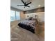 Stylish main bedroom featuring a decorative headboard, neutral tones, and ample natural light at 25968 W Tina Ln, Buckeye, AZ 85396