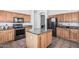 Well-equipped kitchen with granite countertops, stainless steel appliances, and ample cabinet space at 26264 N 74Th Ln, Peoria, AZ 85383