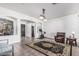 Spacious living room area showcasing tile floors, ample natural light, and neutral paint at 26264 N 74Th Ln, Peoria, AZ 85383