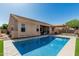 A private pool sits in the backyard, surrounded by an extended patio and a covered seating area at 26264 N 74Th Ln, Peoria, AZ 85383