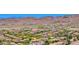 Expansive aerial view of a large community nestled in the desert landscape at 27562 N 99Th Dr, Peoria, AZ 85383