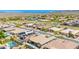 The aerial view shows multiple desert landscaped homes in a well-maintained community at 27562 N 99Th Dr, Peoria, AZ 85383