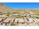 Aerial view showcases the community's landscaping and well-maintained homes at 27562 N 99Th Dr, Peoria, AZ 85383