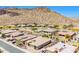 Aerial view shows the well-maintained homes and desert landscaping in the community at 27562 N 99Th Dr, Peoria, AZ 85383