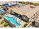 Aerial view of backyard with a private pool, covered patio, and solar panels at 27562 N 99Th Dr, Peoria, AZ 85383