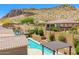 View of a well-maintained backyard with a pool, patio, and privacy walls at 27562 N 99Th Dr, Peoria, AZ 85383