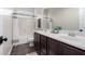 Neutral bathroom featuring double sinks, modern fixtures, and a shower-tub combo at 27562 N 99Th Dr, Peoria, AZ 85383