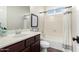 Traditional bathroom featuring coordinated bath and shower features and updated fixtures at 27562 N 99Th Dr, Peoria, AZ 85383