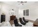 Bonus room offers a casual and functional space with a large accent sign and wood-look flooring at 27562 N 99Th Dr, Peoria, AZ 85383