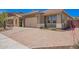 Exterior shot features an extended driveway leading to a well-maintained home at 27562 N 99Th Dr, Peoria, AZ 85383