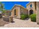 Inviting single-Gathering home featuring an arched entryway and beautiful desert landscaping at 27562 N 99Th Dr, Peoria, AZ 85383