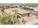 Exterior elevation of home showing the three-car garage and desert landscaping at 27562 N 99Th Dr, Peoria, AZ 85383