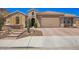 Charming single-Gathering home with a two-car garage and low-maintenance desert landscaping at 27562 N 99Th Dr, Peoria, AZ 85383