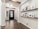 Inviting foyer with wood floors, decorative shelves, and natural light at 27562 N 99Th Dr, Peoria, AZ 85383