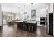 Bright eat-in kitchen features stainless appliances, stone countertops, and a breakfast bar at 27562 N 99Th Dr, Peoria, AZ 85383