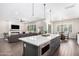 Beautiful kitchen island in open floor plan concept offers ample seating and countertop space at 27562 N 99Th Dr, Peoria, AZ 85383