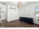 Bright living room with dark wood floors and large sliding doors adding character to the house at 27562 N 99Th Dr, Peoria, AZ 85383